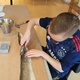Kleine afbeelding van teken boekje met kaft van vis leer
